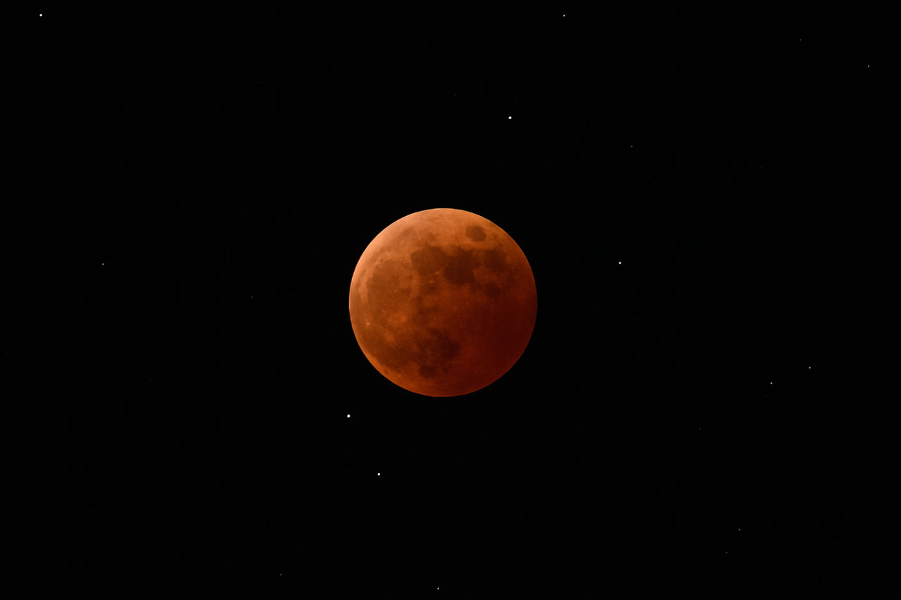 A total lunar eclipse. The moon appears to float in space.