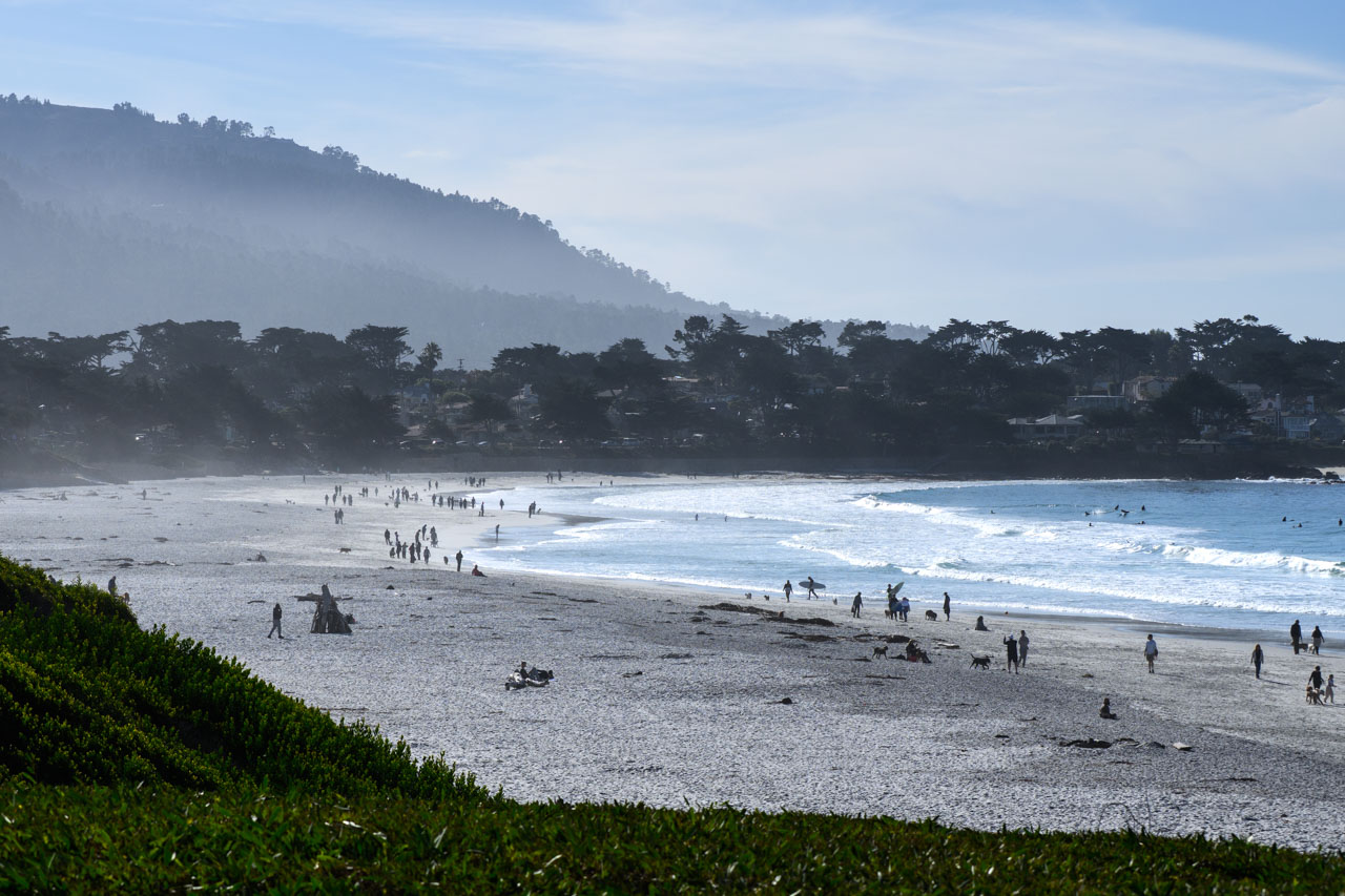 Midday scene at Carmel Beach with tourists